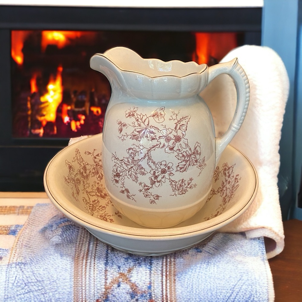 Beautiful antique pitcher and wash basin set.